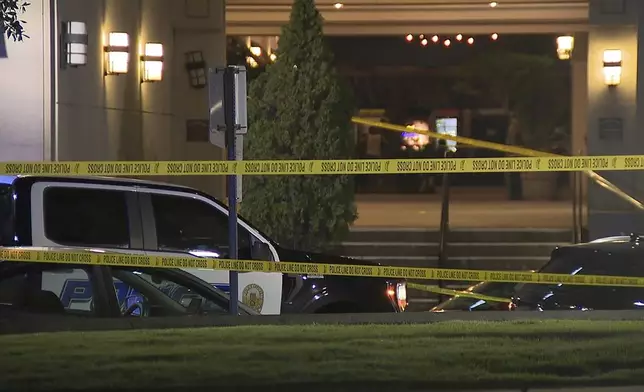 This image provided by WBMA shows police tape near the scene of a shooting in Birmingham, Ala., Sunday, Sept. 22, 2024. (Bill Castle/WBMA via AP)