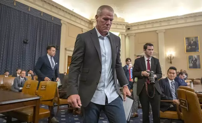 Former NFL quarterback Brett Favre arrives to appear before the House Committee on Ways and Means on Capitol Hill, Tuesday, Sept. 24, 2024, in Washington. (AP Photo/Mark Schiefelbein)