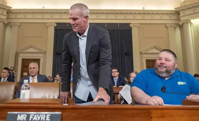 Former NFL quarterback Brett Favre arrives to appear before the House Committee on Ways and Means on Capitol Hill, Tuesday, Sept. 24, 2024, in Washington. (AP Photo/Mark Schiefelbein)