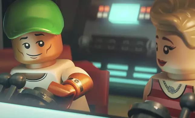 This image released by Focus Features shows lego characters Pharrell Williams, left, and Gwen Stefani in a scene from "Piece By Piece." (Focus Features via AP)