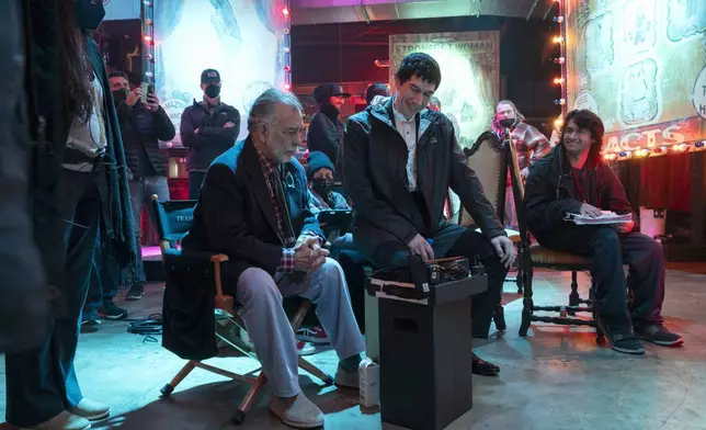 This image released by Lionsgate shows writer/director Francis Ford Coppola, left, and actor Adam Driver on the set of "Megalopolis." (Phil Caruso/Lionsgate via AP)