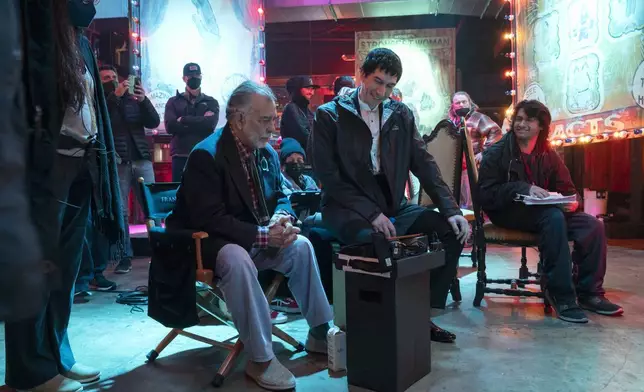 This image released by Lionsgate shows writer/director Francis Ford Coppola, left, and actor Adam Driver on the set of "Megalopolis." (Phil Caruso/Lionsgate via AP)