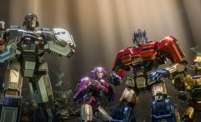 This image released by Paramount Pictures shows characters, from left, D-16/Megatron, voiced by Brian Tyree Henry, Elita-1, voiced by Scarlett Johansson, Orion Pax/Optimus Prime, voiced by Chris Hemsworth, and B-127, voiced by Keegan-Michael Key, in a scene from "Transformers One." (Paramount Pictures via AP)