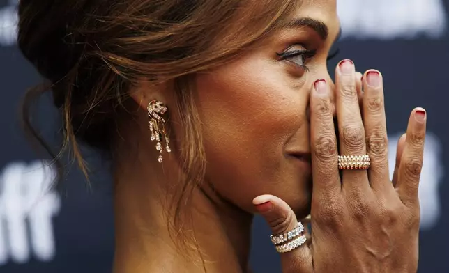 Zoe Saldana arrives on the red carpet for the premiere of 'Emilia Perez' at the Princess of Wales Theatre during the Toronto International Film Festival, in Toronto, on Monday, Sept. 9, 2024. (Cole Burston/The Canadian Press via AP)