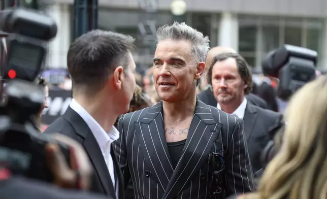 Robbie Williams attends the premiere of "Better Man", during the 2024 Toronto International Film Festival, in Toronto on Monday, Sept. 9, 2024. (Christopher Katsarov/The Canadian Press via AP)