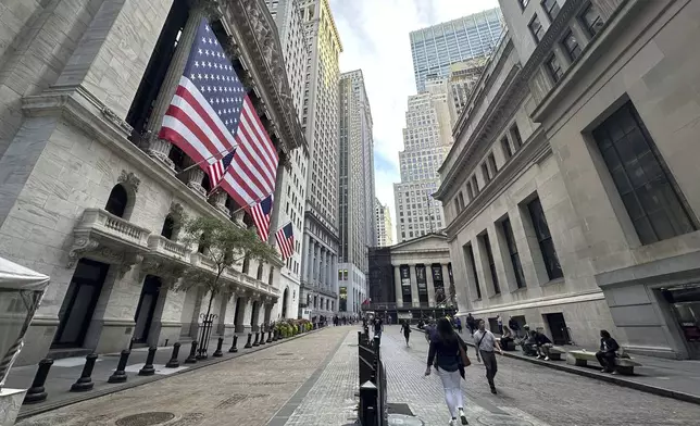 FILE - American flags hang from the front of the New York Stock Exchange on Sept. 11, 2024, in New York. (AP Photo/Peter Morgan, File)