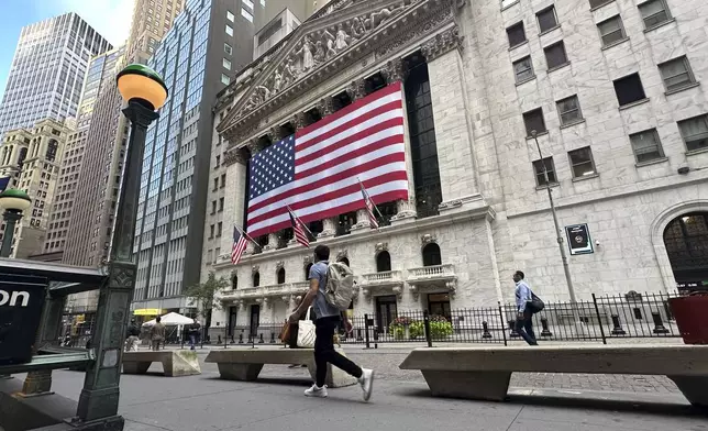 FILE - American flags hang on the front of the New York Stock Exchange on Sept. 11, 2024, in New York. (AP Photo/Peter Morgan, File)