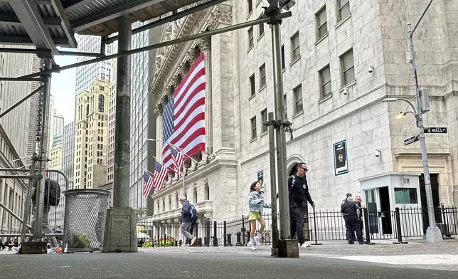 The American flag hangs from the front of the New York Stock Exchange on Wednesday, Sept. 11, 2024, in New York. (AP Photo/Peter Morgan)