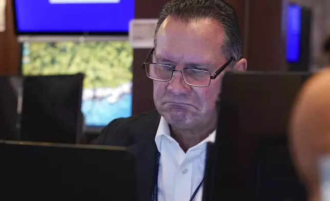 Trader Edward Curran works on the floor of the New York Stock Exchange, Wednesday, Sept. 18, 2024. (AP Photo/Richard Drew)