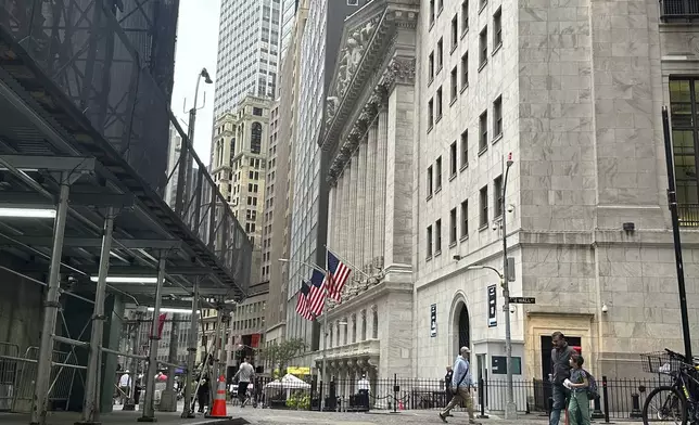 The New York Stock Exchange, center, is shown on Friday, Sept. 27, 2024, in New York. (AP Photo/Peter Morgan)