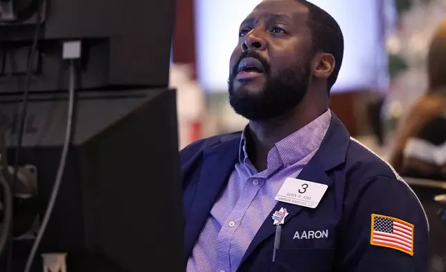 Trader Aaron Ford works on the floor of the New York Stock Exchange, Wednesday, Sept. 18, 2024. (AP Photo/Richard Drew)