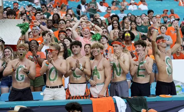 Miami fans cheer before an NCAA football game between Miami and Florida A&amp;M, Saturday, Sept. 7, 2024, in Miami Gardens, Fla. (AP Photo/Lynne Sladky)