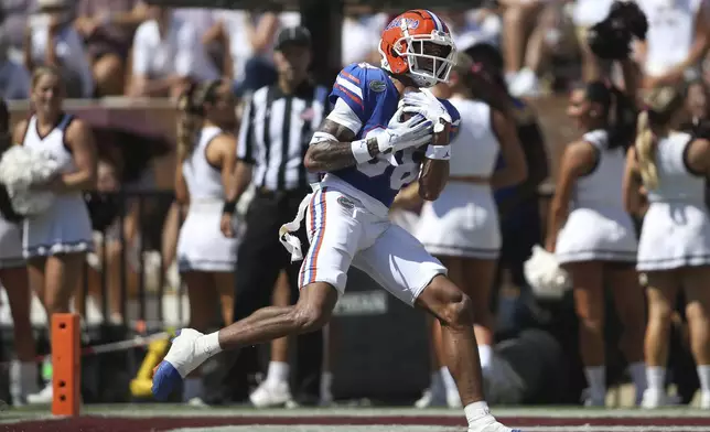 Florida wide receiver Marcus Burke (88) catches a touchdown pass against Mississippi State during the first half of an NCAA college football game in Starkville, Miss., Saturday, Sept. 21, 2024. (AP Photo/James Pugh)