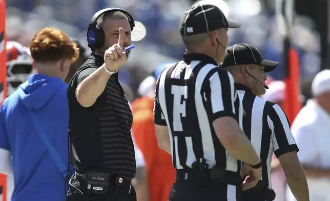 Florida head coach Billy Napier motions to the field judge Phillip Davenport against Mississippi State during the first half of an NCAA college football game in Starkville, Miss., Saturday, Sept. 21, 2024. (AP Photo/James Pugh)