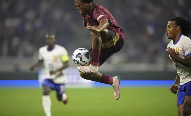 Belgium's Lois Openda controls the ball during the UEFA Nations League soccer match between France and Belgium at the Groupama stadium in Decines, outside Lyon, France, Monday, Sept. 9, 2024. (AP Photo/Laurent Cipriani)