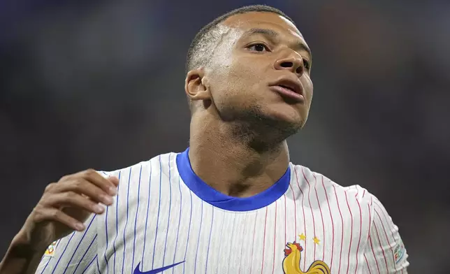 France's Kylian Mbappe reacts during the UEFA Nations League soccer match between France and Belgium at the Groupama stadium in Decines, outside Lyon, France, Monday, Sept. 9, 2024. (AP Photo/Laurent Cipriani)