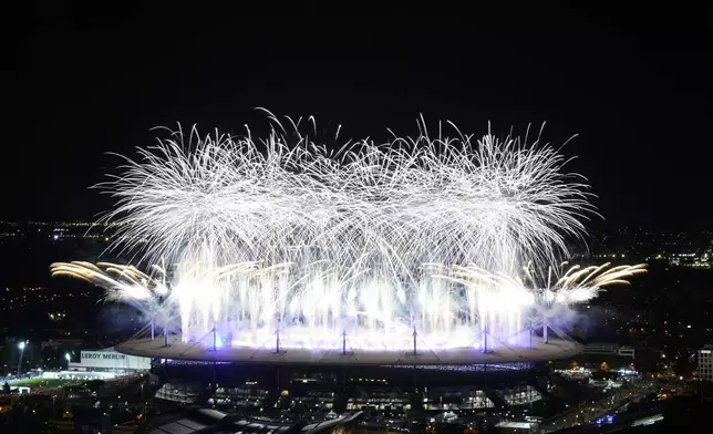 FILE - Fireworks signal the end of the 2024 Summer Olympics closing ceremony taking place at the Stade de France, Monday, Aug. 12, 2024, in Saint-Denis, France. (AP Photo/Luca Bruno, file)