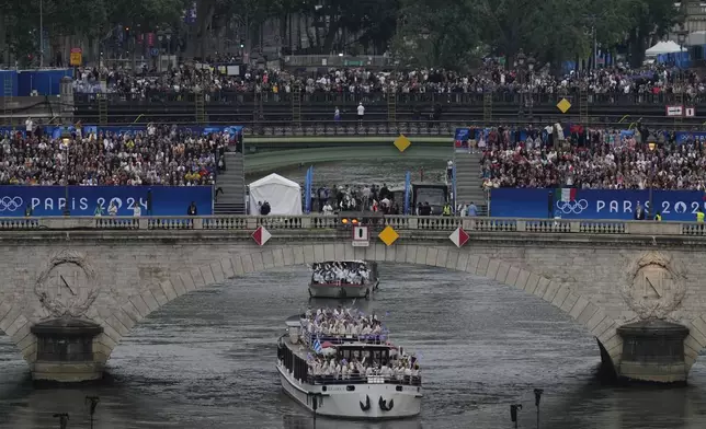 FILE - Team Greece travels by boat along the Seine river in Paris, France, during the opening ceremony of the 2024 Summer Olympics, Friday, July 26, 2024. (AP Photo/Ricardo Mazalan, file)