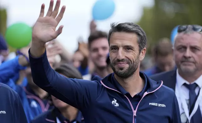 French President of the Paris 2024 Olympics and Paralympics Organising Committee (COJO) Tony Estanguet, walks down the Champs Elysees avenue on the day of a parade for all the French athletes who participated in the 2024 Olympics and Paralympics, Saturday, Sept. 14, 2024 in Paris. (AP Photo/Aurelien Morissard, Pool)