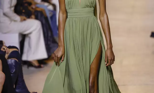 A model wears a creation as part of the Elie Saab Spring/Summer 2025 collection presented Saturday, Sept. 28, 2024, in Paris. (Photo by Vianney Le Caer/Invision/AP)