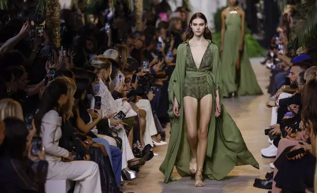 A model wears a creation as part of the Elie Saab Spring/Summer 2025 collection presented Saturday, Sept. 28, 2024, in Paris. (Photo by Vianney Le Caer/Invision/AP)