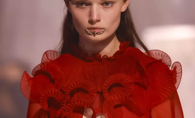 A model wears a creation as part of the Valentino Spring/Summer 2025 collection presented Sunday, Sept. 29, 2024 in Paris. (Photo by Vianney Le Caer/Invision/AP)