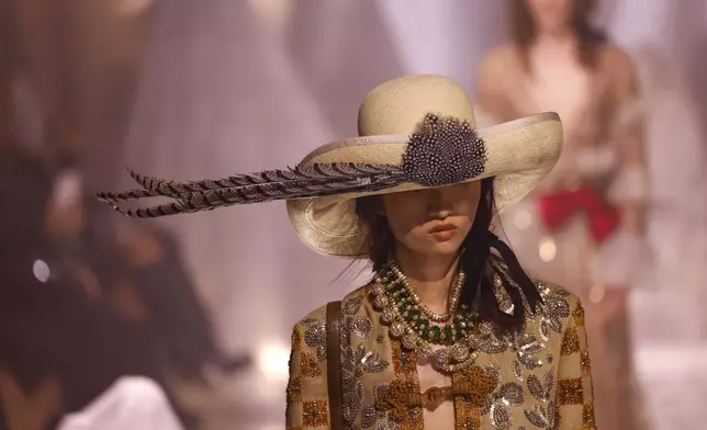 A model wears a creation as part of the Valentino Spring/Summer 2025 collection presented Sunday, Sept. 29, 2024 in Paris. (Photo by Vianney Le Caer/Invision/AP)