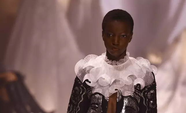 A model wears a creation as part of the Valentino Spring/Summer 2025 collection presented Sunday, Sept. 29, 2024 in Paris. (Photo by Vianney Le Caer/Invision/AP)