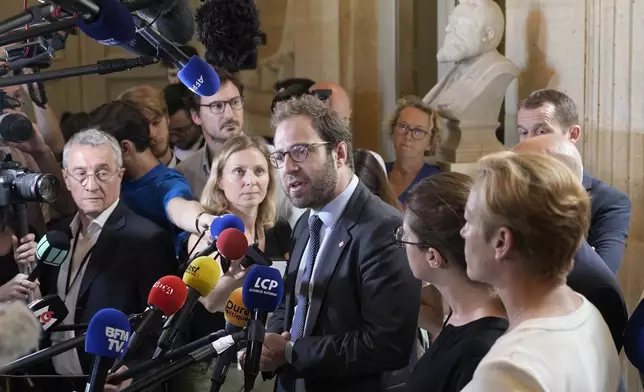 FILE - Antoine Armand, center, deputy for the French Alps Savoie region, speaks at the National Assembly, Thursday, June 8, 2023 in Paris. (AP Photo/Lewis Joly, File)