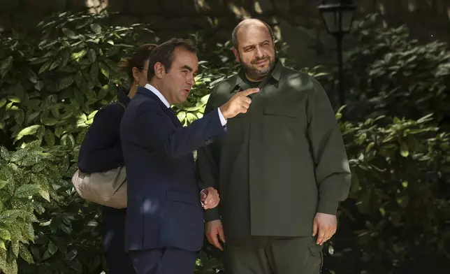 FILE - French Defense Minister Sebastien Lecornu, left, greets his Ukrainian counterpart Rustem Umerov as he arrives for a meeting in Paris, France, Monday, Sept. 2, 2024. (AP Photo/Thomas Padilla, File)