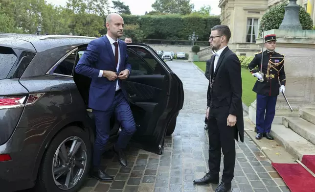 New French Foreign Minister Jean-Noel Barrot gets out of a car as he arrives for the handover ceremony, Monday, Sept. 23, 2024 in Paris. (Thomas Samson, Pool via AP)