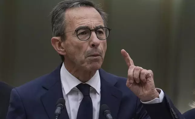 New French Interior Minister Bruno Retailleau, gestures as he delivers a speech during the handover ceremony at the ministry, Monday, Sept. 23, 2024 in Paris. (AP Photo/Christophe Ena)