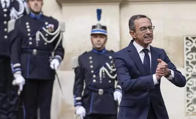New French Interior Minister Bruno Retailleau, right, attends the handover ceremony at the ministry, Monday, Sept. 23, 2024 in Paris. (AP Photo/Christophe Ena)