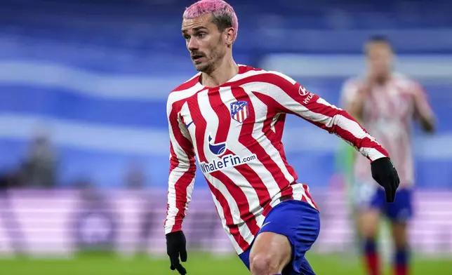 FILE - Atletico Madrid's Antoine Griezmann during a Spanish La Liga soccer match between Real Madrid and Atletico Madrid at the Santiago Bernabeu stadium in Madrid, Spain, Saturday, Feb. 25, 2023. (AP Photo/Manu Fernandez, File)