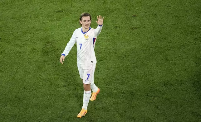 FILE - Antoine Griezmann of France waves to fans after losing during a semifinal match between Spain and France at the Euro 2024 soccer tournament in Munich, Germany, Tuesday, July 9, 2024. (AP Photo/Ebrahim Noroozi, File)