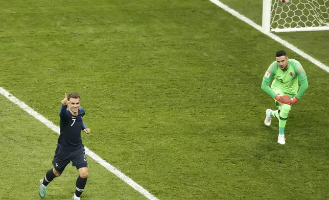 FILE - France's Antoine Griezmann, right, celebrates after scoring a penalty kick during the final match between France and Croatia at the 2018 soccer World Cup in the Luzhniki Stadium in Moscow, Russia, Sunday, July 15, 2018. (AP Photo/Frank Augstein, File)