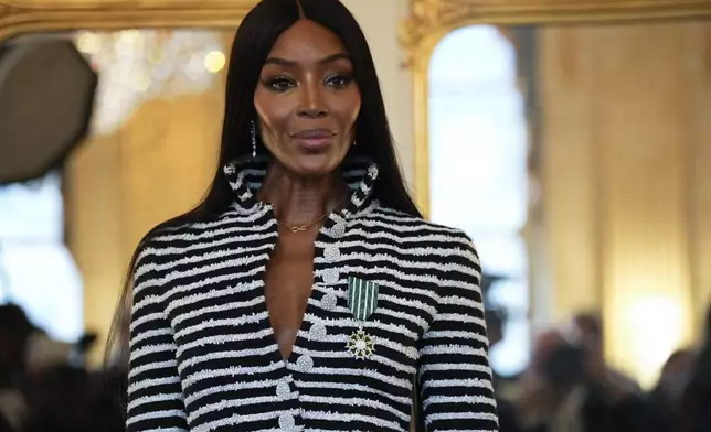 Naomi Campbell poses with the medal of "Chevalier de l'Ordres des Arts et des Lettres", after being awarded by French Culture Minister Rachida Dati, at the Culture ministry, in Paris, Thursday, Sept. 26, 2024. (AP Photo/Louise Delmotte)