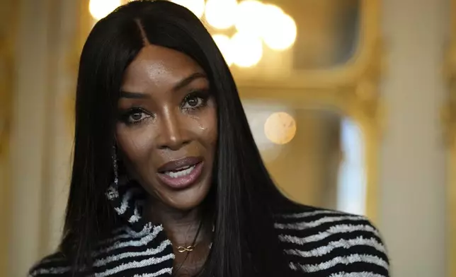 Naomi Campbell delivers a speech after being awarded with the medal of "Chevalier de l'Ordres des Arts et des Lettres", at the Culture ministry, in Paris, Thursday, Sept. 26, 2024. (AP Photo/Louise Delmotte)