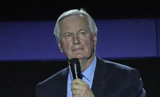 File - Michel Barnier, supporter of conservative presidential candidate Valerie Pecresse speaks during a campaign rally on Feb. 13, 2022 in Paris. President Emmanuel Macron named the former EU Brexit negotiator as France's new prime minister on Thursday after more than 50 days of caretaker government. (AP Photo/Francois Mori, File)