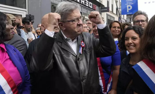 France Unbowed leader Jean-Luc Melenchon, center, who criticized as a power grab the president's appointment of a conservative new prime minister, Michel Barnier, gestures as he participates in a protest demonstration in Paris, France, Saturday, Sept. 7, 2024. (AP Photo/Michel Euler)