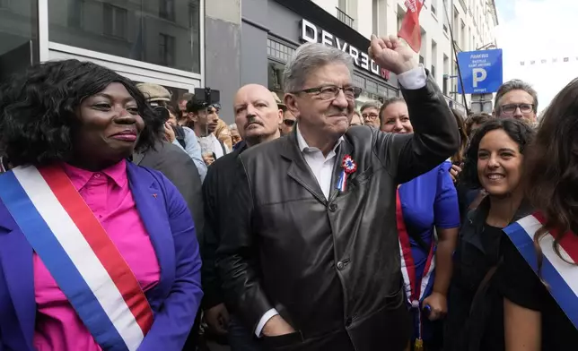 France Unbowed leader Jean-Luc Melenchon, center, who criticized as a power grab the president's appointment of a conservative new prime minister, Michel Barnier, gestures as he participates in a protest demonstration in Paris, France, Saturday, Sept. 7, 2024. (AP Photo/Michel Euler)