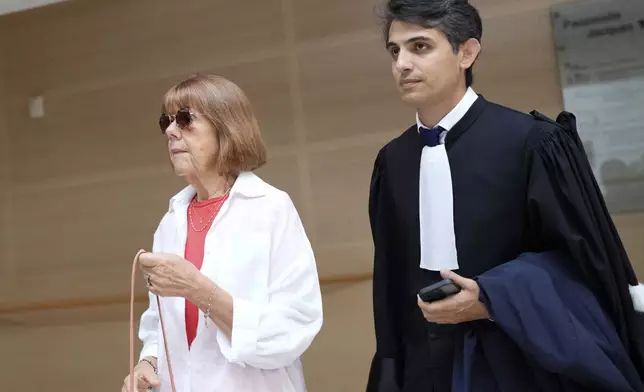 Gisele Pelicot, left, arrives in the Avignon court house, in Avignon, southern France, Thursday, Sept. 5, 2024. A woman allegedly drugged by her ex-husband so that she could be raped by other men while she laid unconscious, is expected to testify before a panel of French judges. (AP Photo/Lewis Joly)