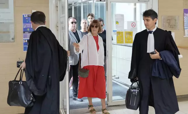 Gisele Pelicot arrives in the Avignon court house, in Avignon, southern France, Thursday, Sept. 5, 2024. A woman allegedly drugged by her ex-husband so that she could be raped by other men while she laid unconscious, is expected to testify before a panel of French judges. (AP Photo/Lewis Joly)