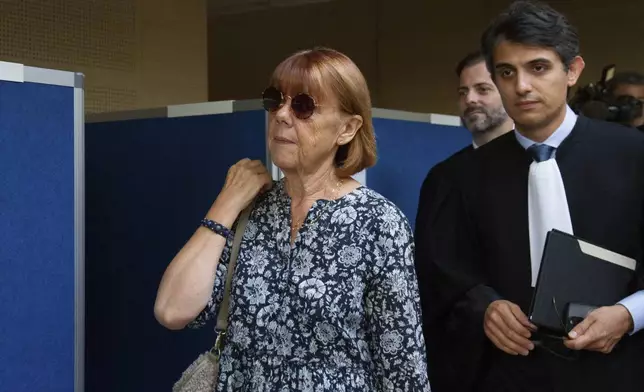 Gisele Pelicot arrives at the Avignon court house, in Avignon, southern France, Tuesday, Sept. 17, 2024. Her ex-husband admitted in court that for nearly a decade, he repeatedly drugged his unwitting wife and invited dozens of men to rape her while she lay unconscious. (AP Photo/Diane Jantet)