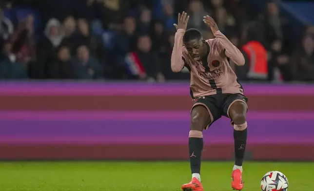 PSG's Ousmane Dembele reacts during the French League One soccer match between Paris Saint-Germain and Rennes at the Parc des Princes in Paris, Friday, Sept. 27, 2024. (AP Photo/Thibault Camus)