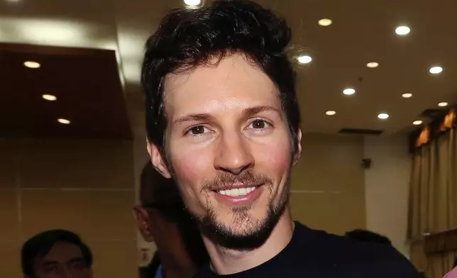 FILE - Telegram co-founder Pavel Durov smiles following his meeting with Indonesian Communication and Information Minister Rudiantara in Jakarta, Indonesia, on Aug. 1, 2017. (AP Photo/Tatan Syuflana, File)