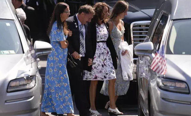 Mourners arrive for a funeral for Columbus Blue Jackets hockey player John Gaudreau Gaudreau and his brother Matthew Gaudreau at St. Mary Magdalen Catholic Church in Media, Pa., Monday, Sept. 9, 2024. (AP Photo/Matt Rourke)