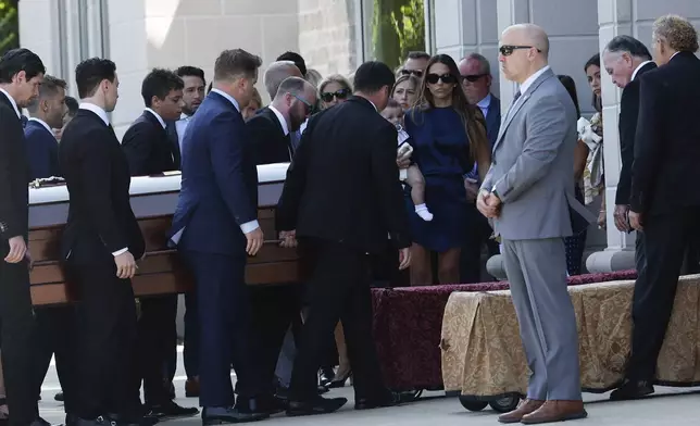 Pallbearers carry the casket of Columbus Blue Jackets hockey player John Gaudreau before funeral services for Gaudreau and his brother Matthew Gaudreau at Saint Mary Magdalen Church in Media, Pa., Monday, Sept. 9, 2024. (Yong Kim/The Philadelphia Inquirer via AP)