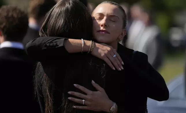 Mourners arrive for a funeral for Columbus Blue Jackets hockey player John Gaudreau and his brother Matthew Gaudreau at St. Mary Magdalen Catholic Church in Media, Pa., Monday, Sept. 9, 2024. (AP Photo/Matt Rourke)