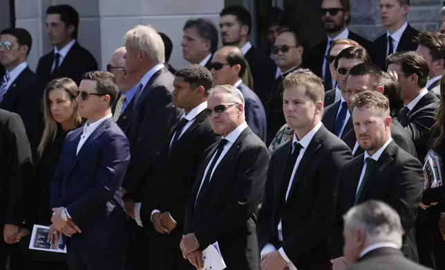 Mourners watch as the remains of Columbus Blue Jackets hockey player John Gaudreau and his brother Matthew Gaudreau depart after a funeral at St. Mary Magdalen Catholic Church in Media, Pa., Monday, Sept. 9, 2024. (AP Photo/Matt Rourke)